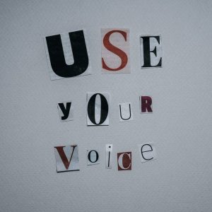 use your voice inscription on gray background